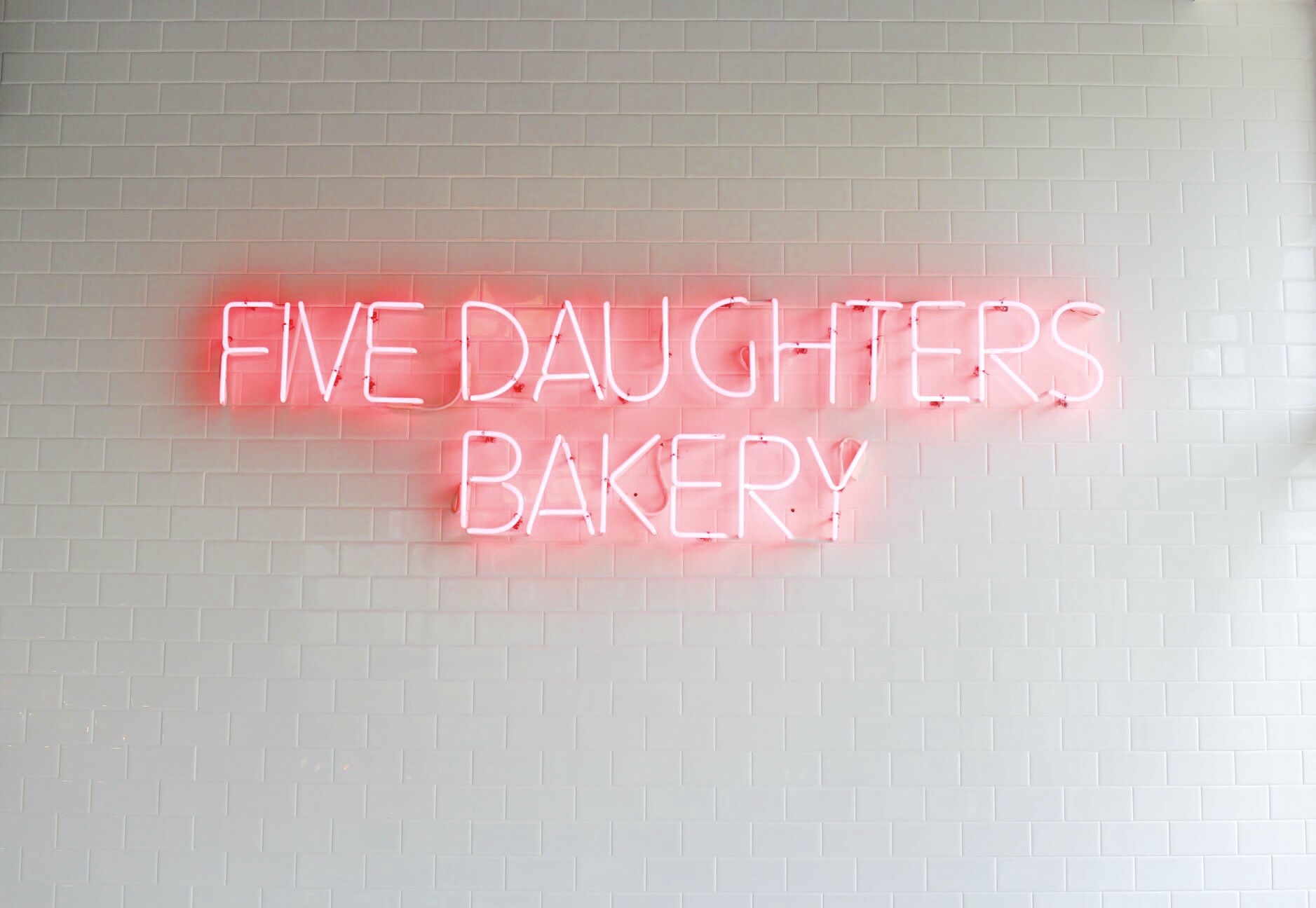 The best local restaurants in Nashville, Tennessee - neon sign five daughters bakery 