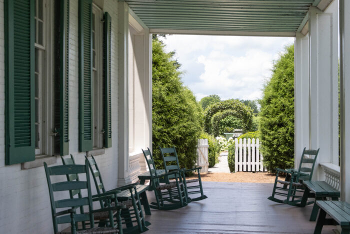 Things to do on a Day Trip to Franklin, TN - Carnton Plantation back porch with view of gardens