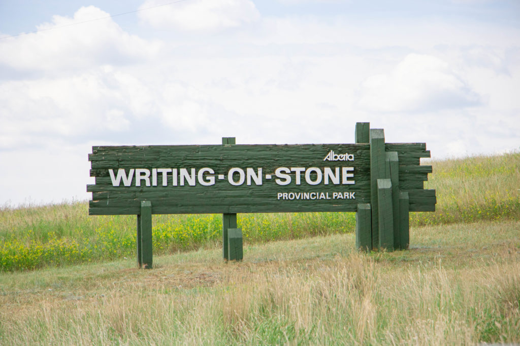 Writing on Stone Provincial Park green entrance sign