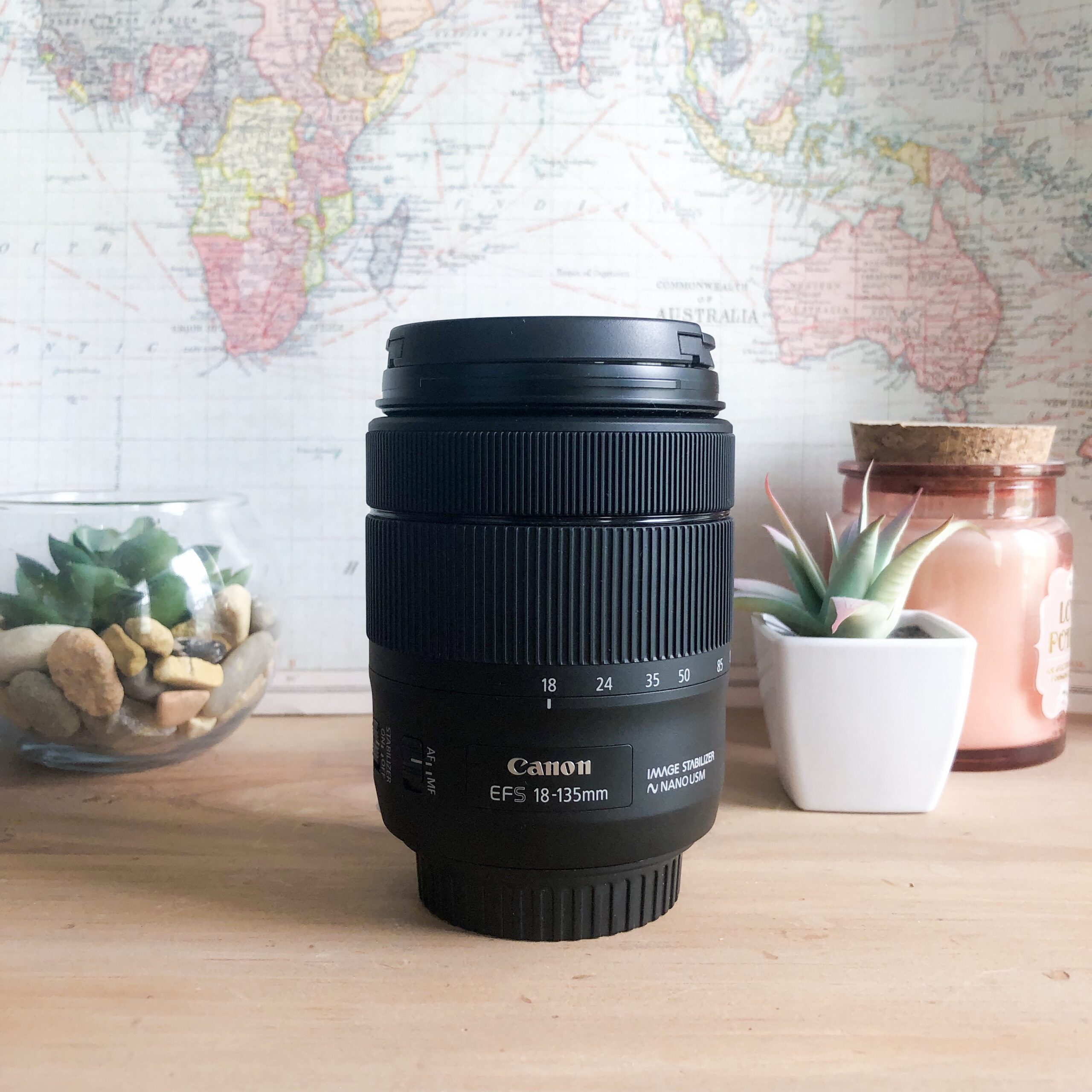 Best Travel Lens Canon 18-135 mm lens with map background