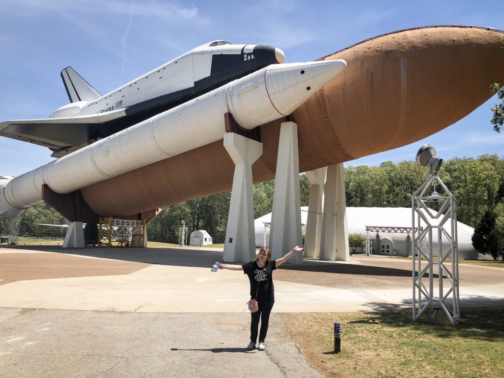 girl in front of us space and rocket center space shuttle in huntsville alabama
