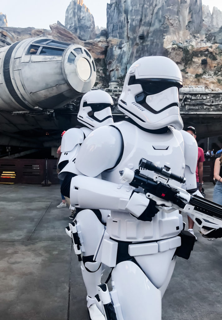 2 stormtroopers marching in front of millenium falcon at Star Wars galaxy's edge Disney World Hollywood Studios Orlando Florida