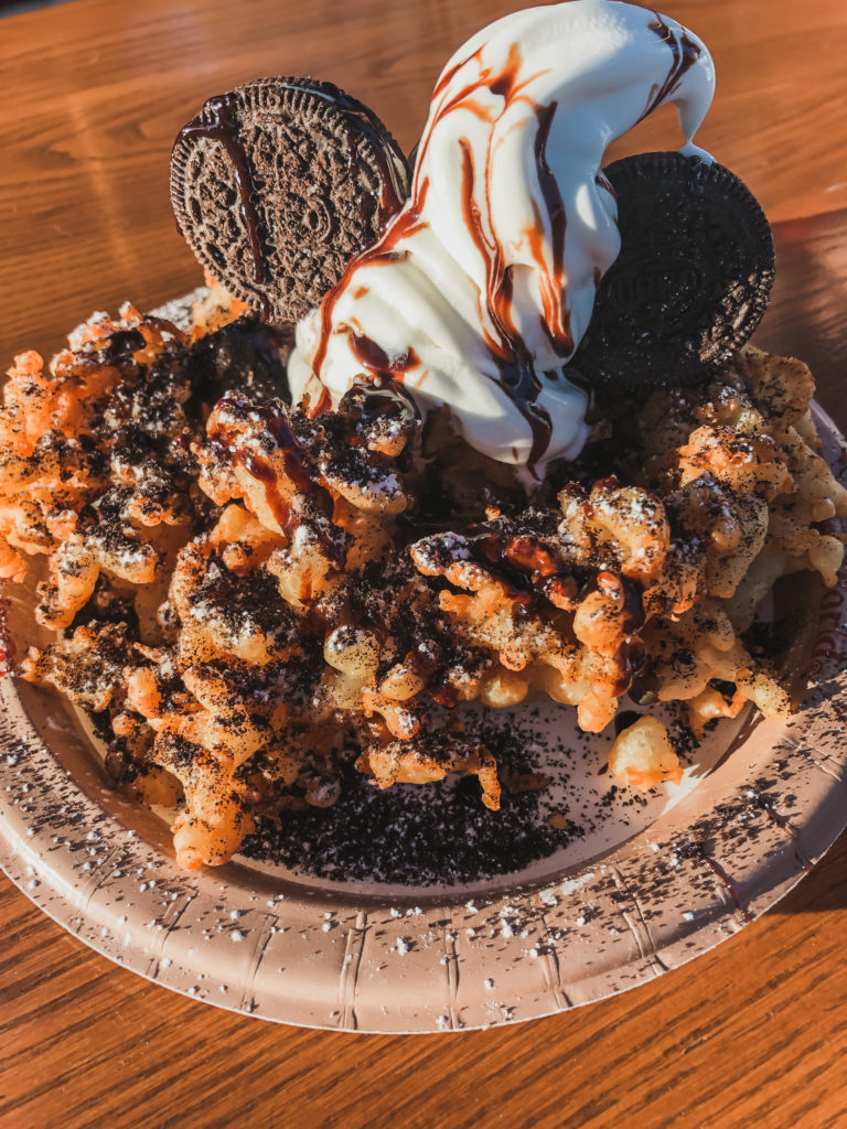 funnel cake with soft serve vanilla ice cream and Oreos cookies and cream Disney World Hollywood Studios snacks epic eats