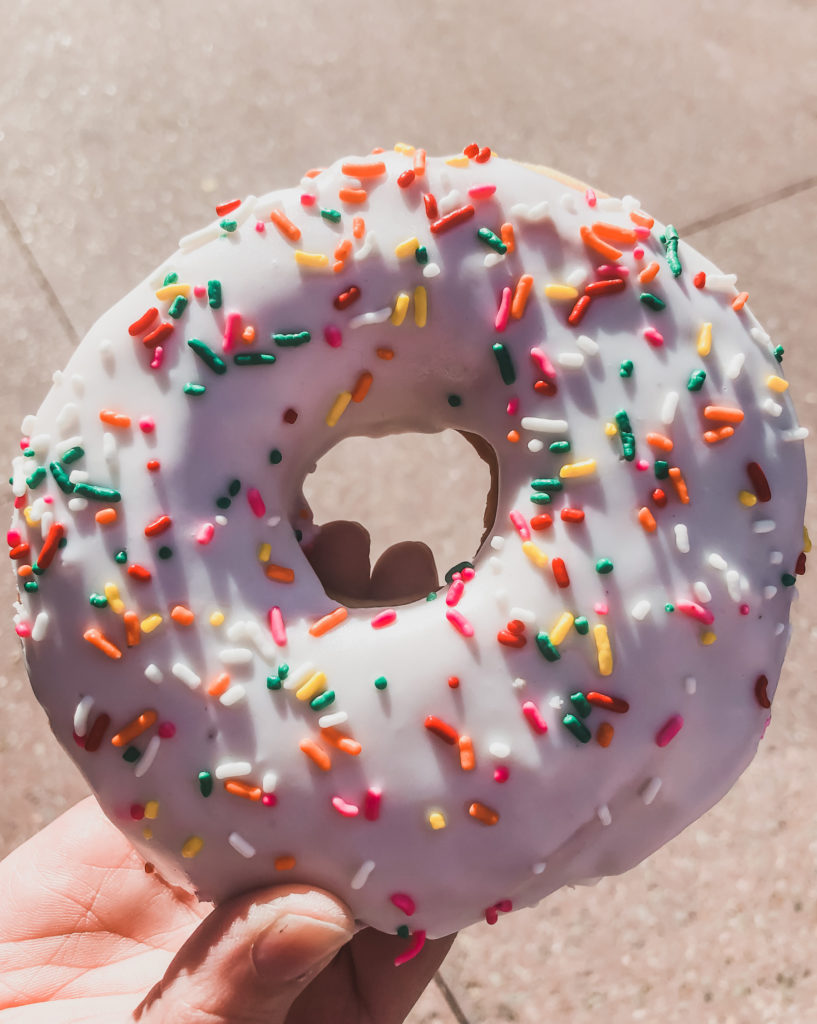 joffreys giant white frosted donut with sprinkles in Epcot Disney World snacks