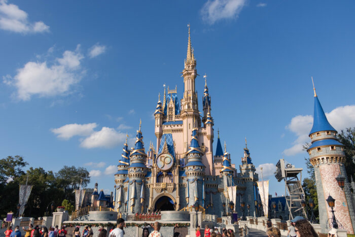 5 Must-Do's in Magic KIngdom in Disney World, Orlando, Florida - Cinderella's Castle decorated for 50th anniversary celebration