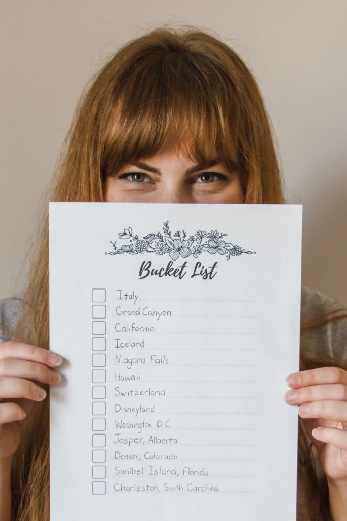 girl with red hair holding bucket list 30 before 30 free printable
