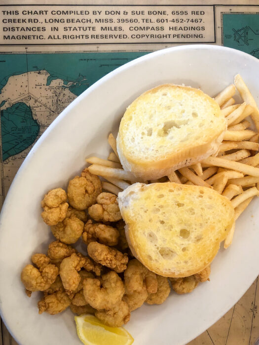 Day Trip to Long Beach, Mississippi - Lil' Ray's Seafood Restaurant Popcorn shrimp, fries, and buttered toast on top of map table