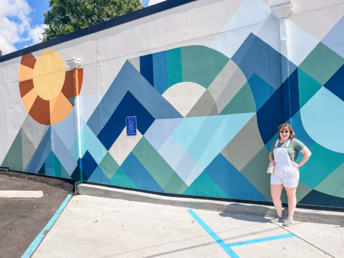 Blue and green mural in Nashville, Tennessee outside Vuori clothing store on 12 Ave South