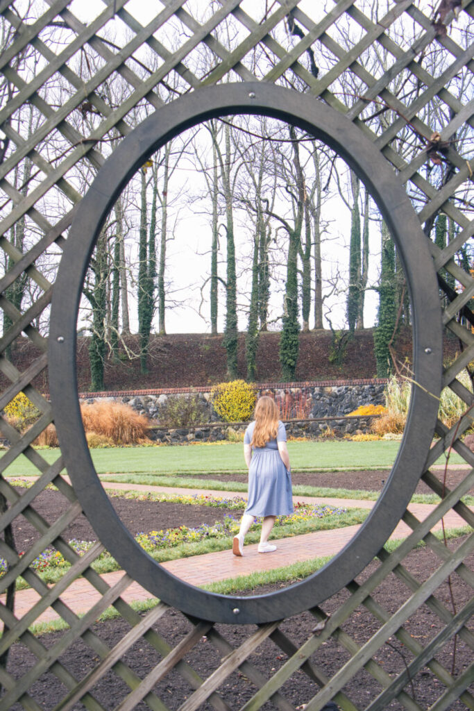 Why You Should Visit the Biltmore Estate at Christmas Time - Girl walking through the Biltmore Estate Gardens