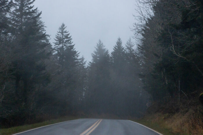 Great Smoky Mountain National Park - Top of the mountains covered in clouds - moody road