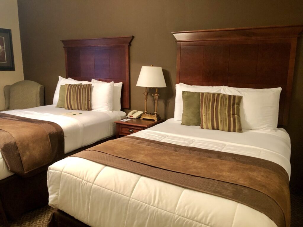 Things to Do on a Day Trip to Flat Rock, North Carolina - The Lodge at Flat Rock Studio suite accommodations with two double beds in hotel room