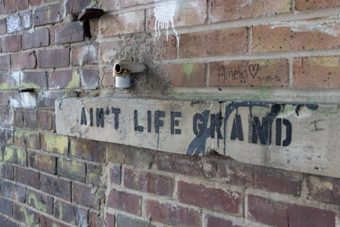 Weekend Getaway to Gulf Coast of Mississippi - Ain't Life Grand graffiti in Fishbone Alley, Gulfport, MS